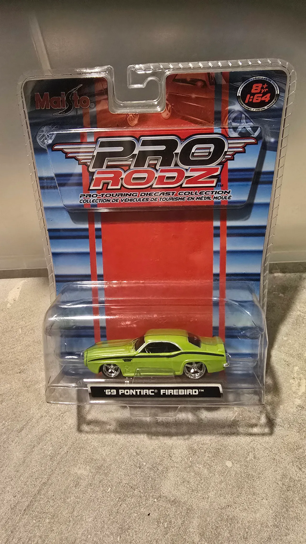Lime green 1969 Pontiac Firebird with a black side stripe by Maisto, Pro Rodz Pro-Touring, in its blister pack