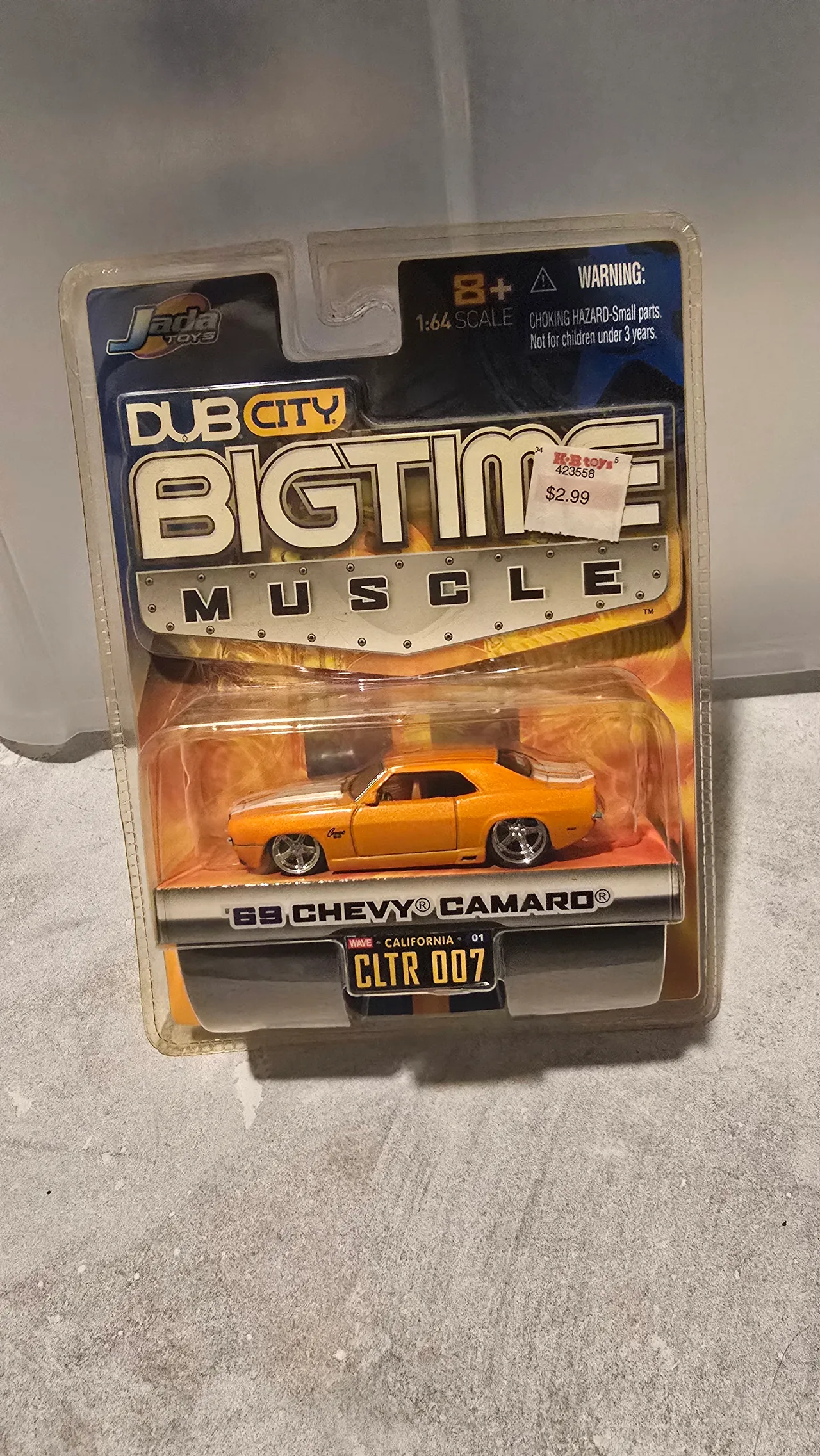 Orange 1969 Chevy Camaro with white stripes by Jada Toys, Dub City Big Time Muscle, in its blister pack