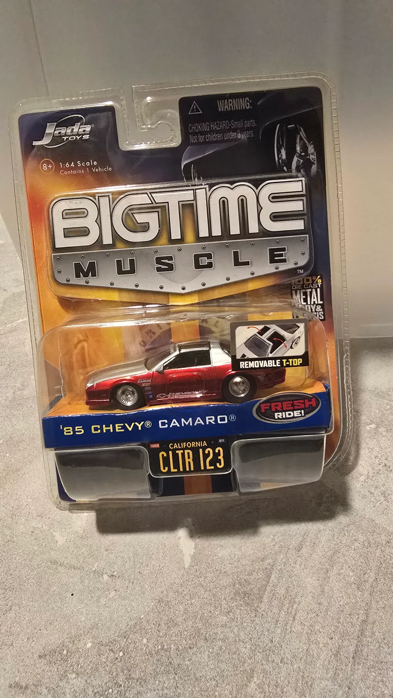 Red and silver 1985 Chevy Camaro with removable T-top by Jada Toys, Big Time Muscle, in its blister pack