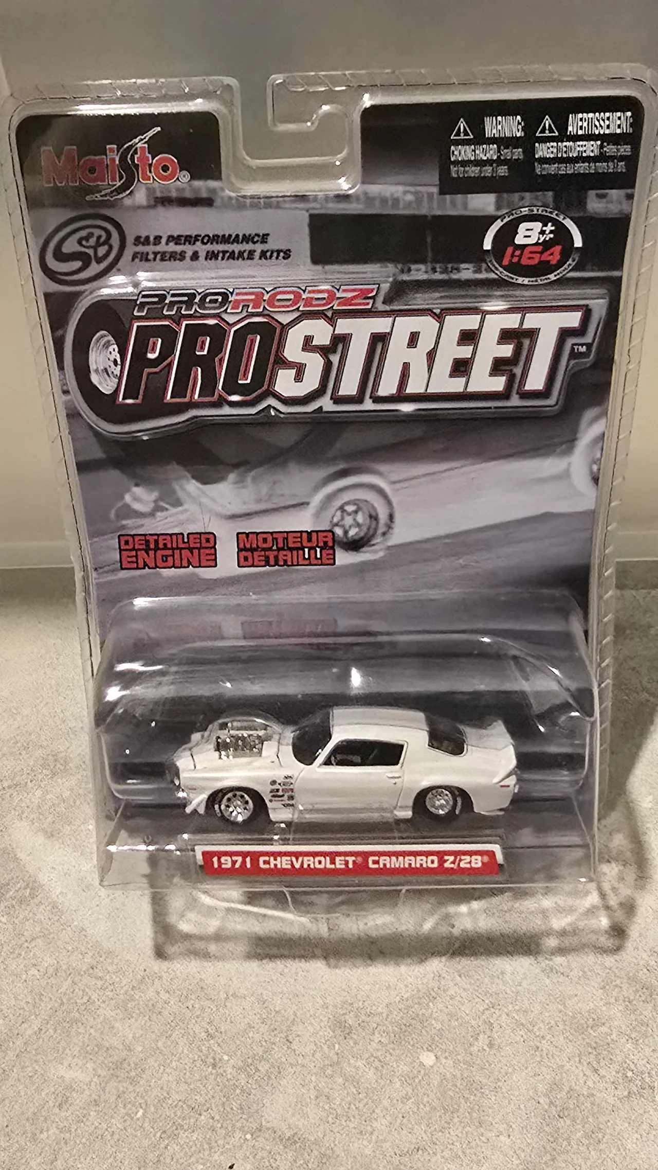 White 1971 Chevy Camaro Z/28 drag car with a black roof and a blower by Maisto, Pro Rodz Pro Street, in its blister pack