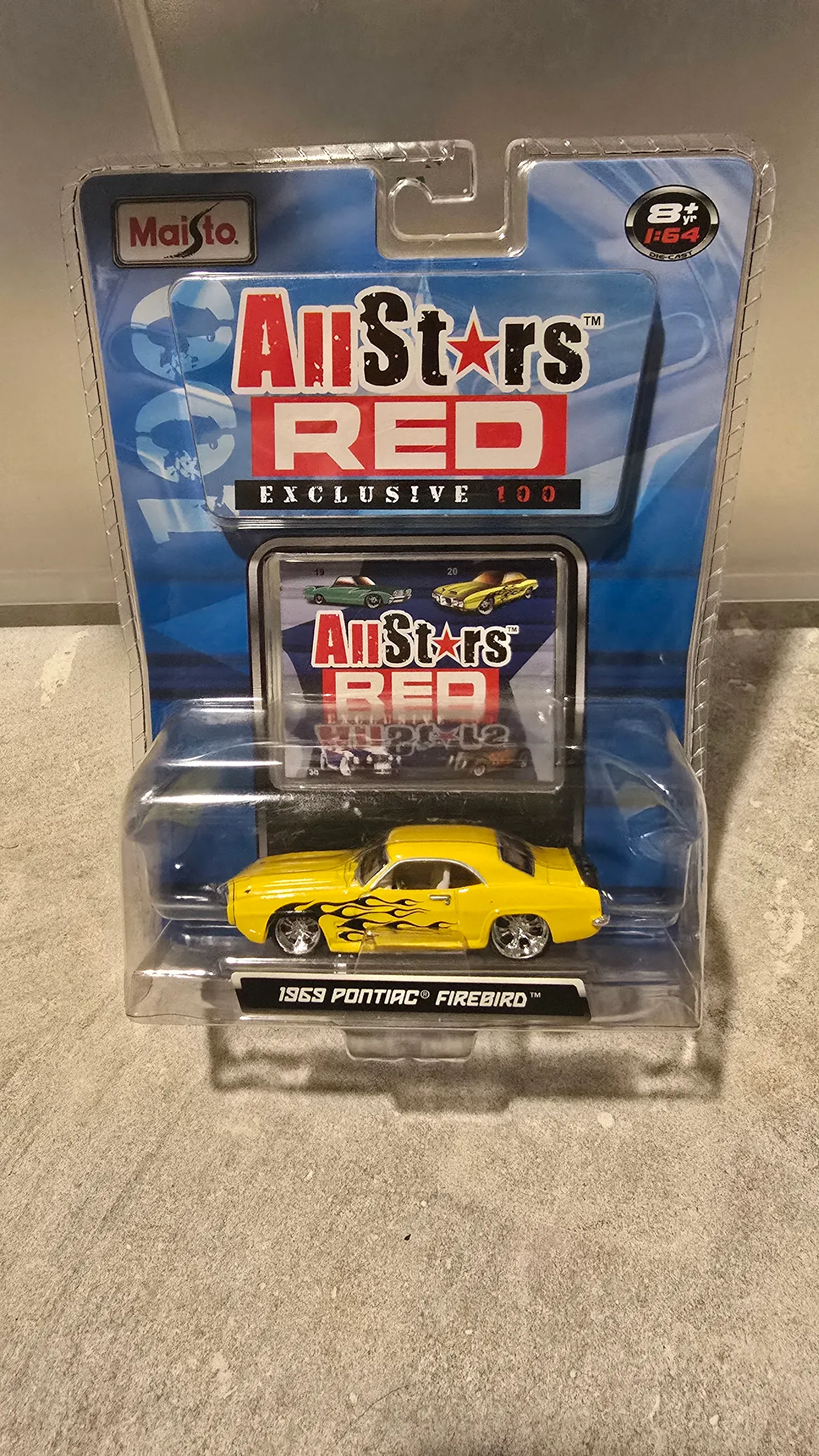 Yellow 1969 Pontiac Firebird with black flames by Maisto, AllStars, in its blister pack