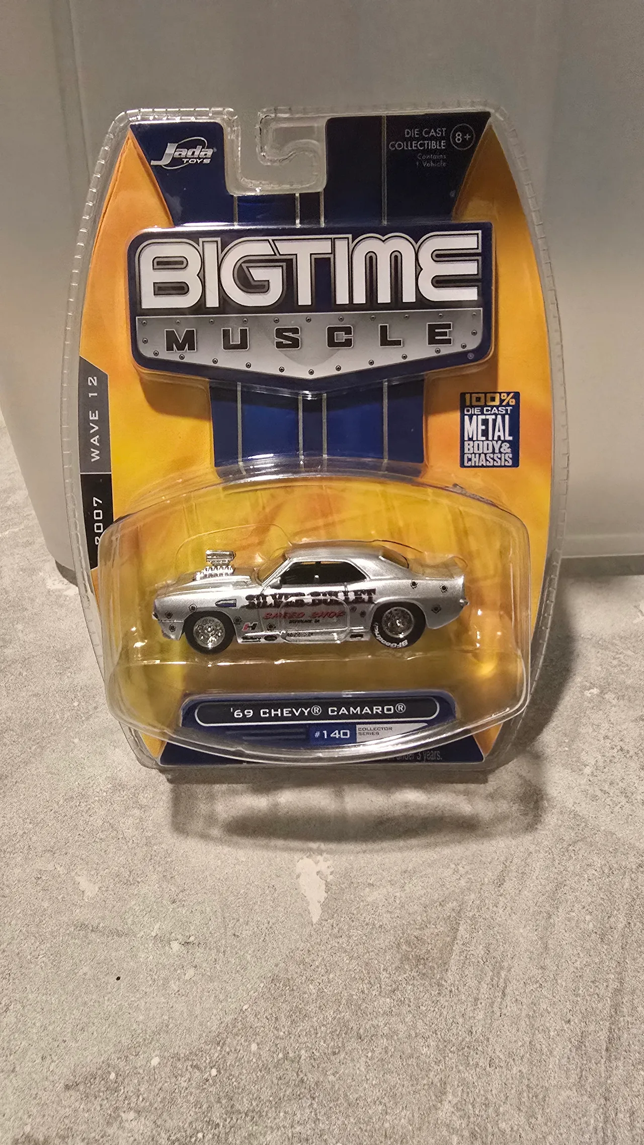 Silver 1969 Chevy Camaro drag car with Silver Bullet livery and a blower by Jada Toys, Big Time Muscle, in its blister pack