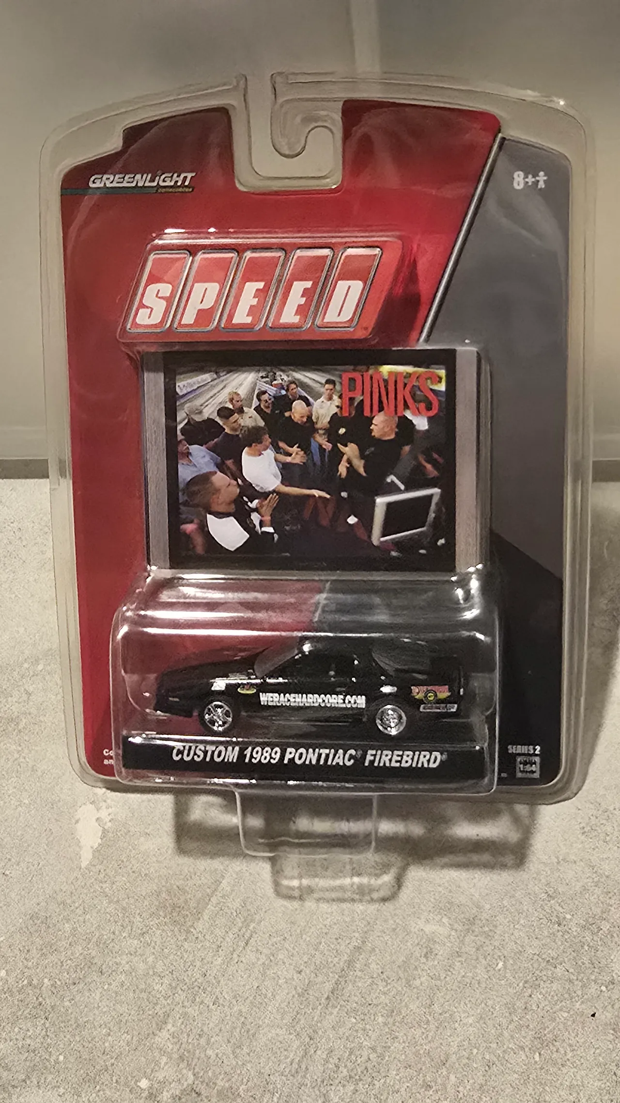 Black custom 1989 Pontiac Firebird with WeRaceHardcore.com graphics by Greenlight, Speed Pinks Series 2, in its blister pack