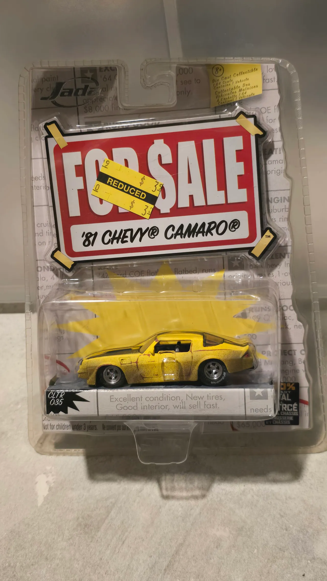 Weathered yellow 1981 Chevy Camaro project car by Jada Toys, For Sale, in its blister pack with a reduced-price sticker